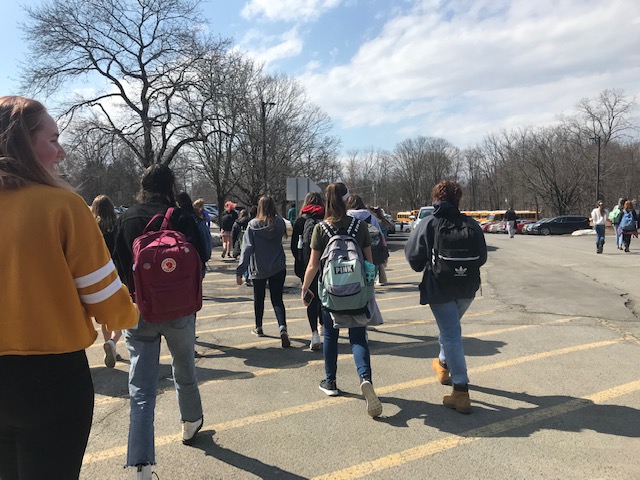 Students walk out at the beginning of 9th period on March 15th.