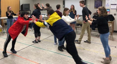 Miriam Palastra and Bryce Aierstock engage in a trust fall exercise.  The upcoming pep rally alternative will include team building activities.