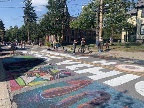 Colorful artwork commemorates the 20th annual Street painting. 