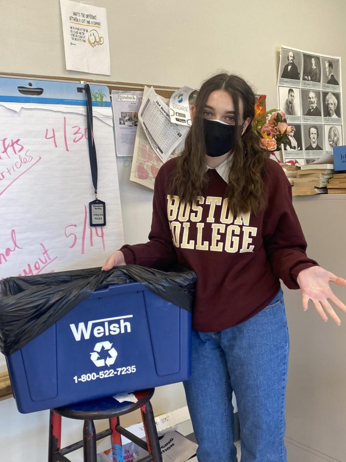 Eleanor Butler, Co-president of the environmental club wonders why there is a black plastic bag over classroom recycling bins this year.  Butler assumes trash and recycling are being thrown out together.  

