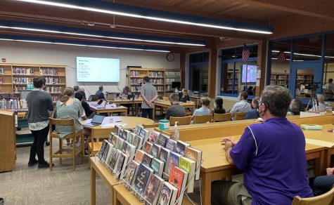 Student Council President, Riley LeHane at left, looks on as Senior class president, Matthew Raccuia at center, presents some of his ideas and goals for the new school year. Student Council Advisor Mr. Moor, (right) watches the presentation.