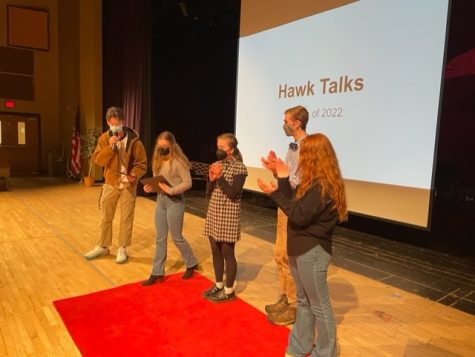 Bryce Aierstok congratulates Hawk Talk winners Camdyn Rakow, Olivia Selby, Logan Dykeman, and Joey Dull.
