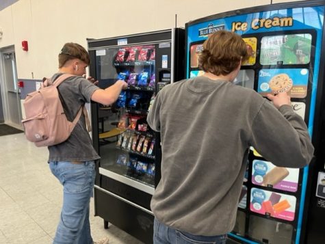 Hungry seniors Jack Viator and Sean Duke struggle to control their appetite for the new vending machine snacks brought to us this year by the Sophomore Class Council. 