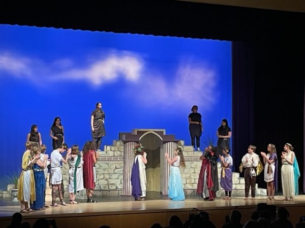 The audience cheers both cast and crew for making them feel like they were in Ancient Greece with great lighting, costumes, and set design. 