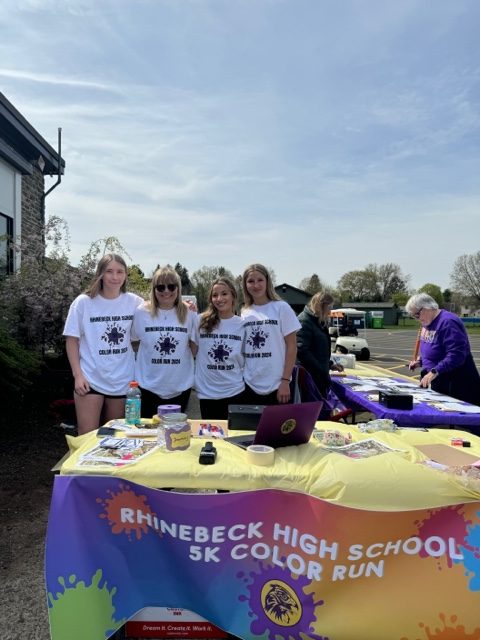 Gwen Dampf, Meg Winters, Ella Romeo, and Sofia Santoro organized the runners, color stations, and silent auction.