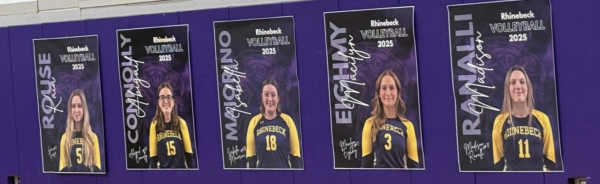 Varsity volleyball senior posters cover the walls in the gym on Senior Night.